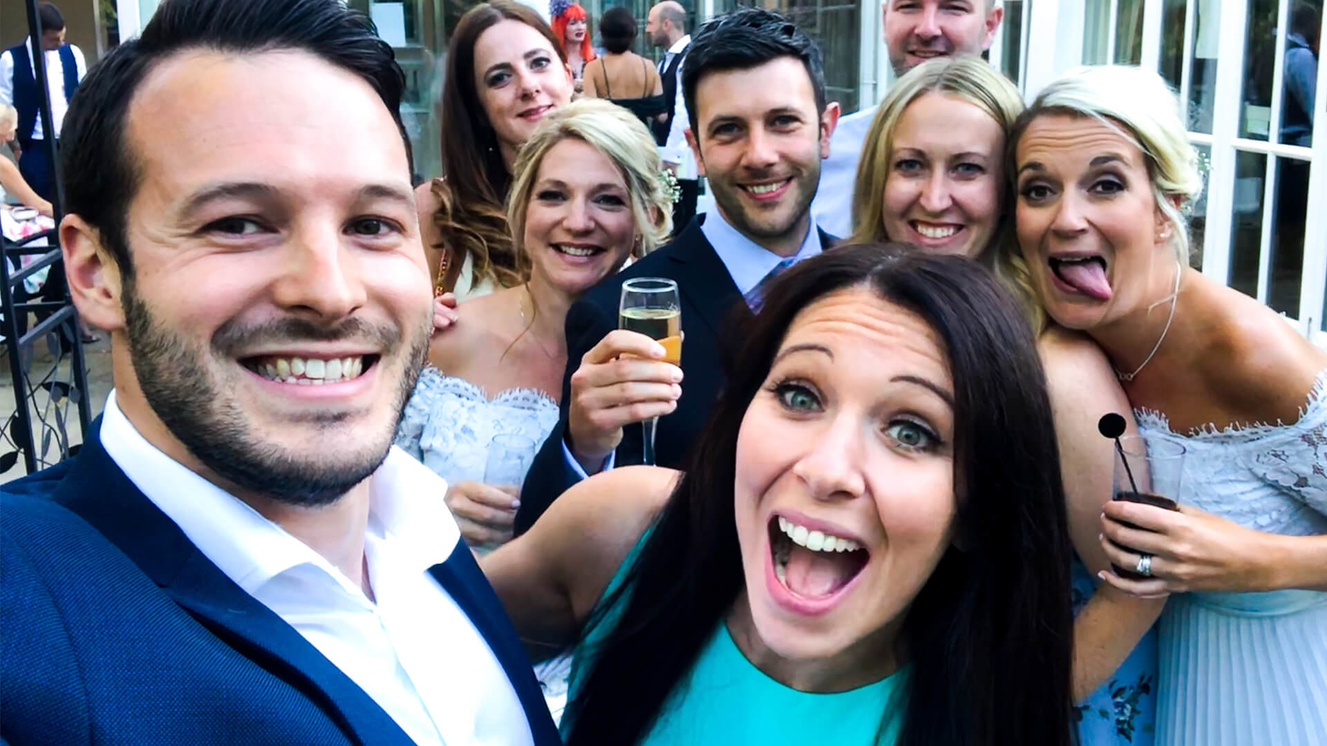 Aaron Calvert Manchester Wedding Magician taking selfie with guests during wedding entertainment